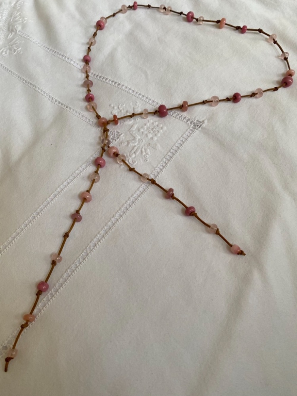 Pink Lariat Necklace comprised a 45 pink opal, rhodolite, and rose quartz beads